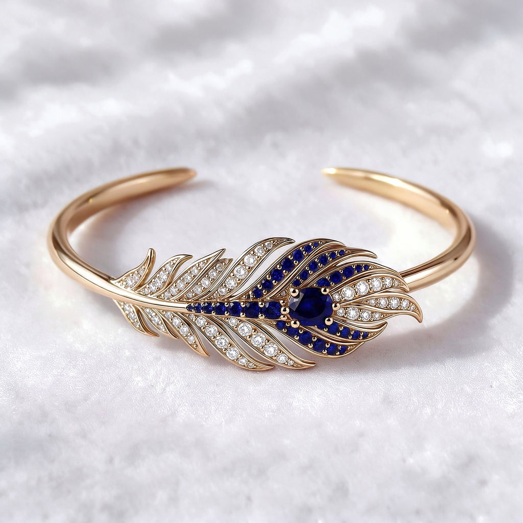 The Plume Cuff — 18K Gold Vermeil Feather Bangle with Royal Blue Lab Sapphire