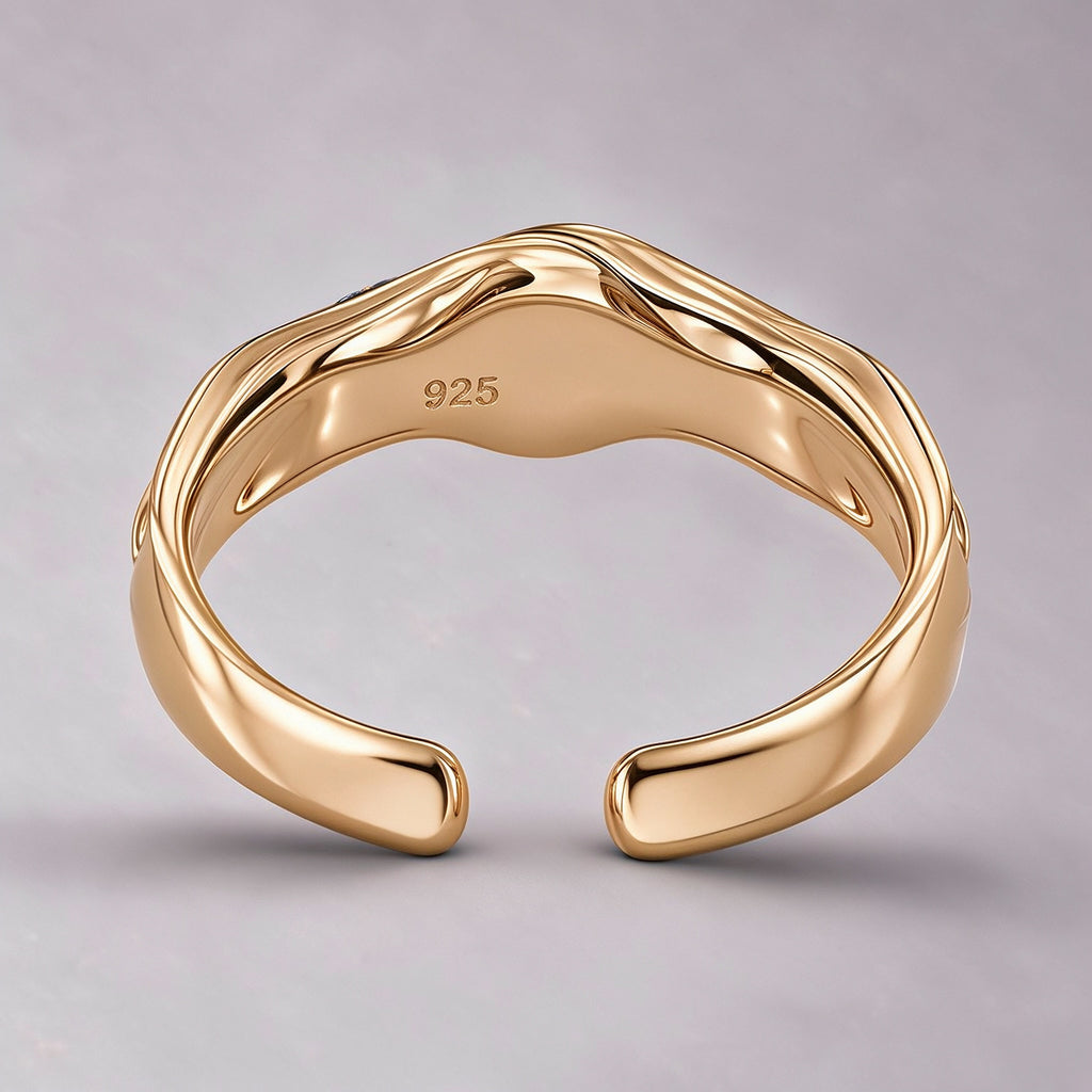 The Nereid Cuff from the inner side, a polished plane with a recessed 925 hallmark and rounded terminals